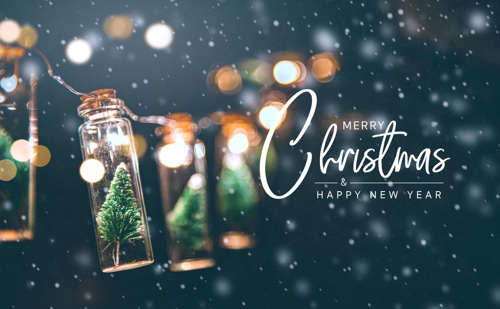 Snow falling on Christmas trees in jars